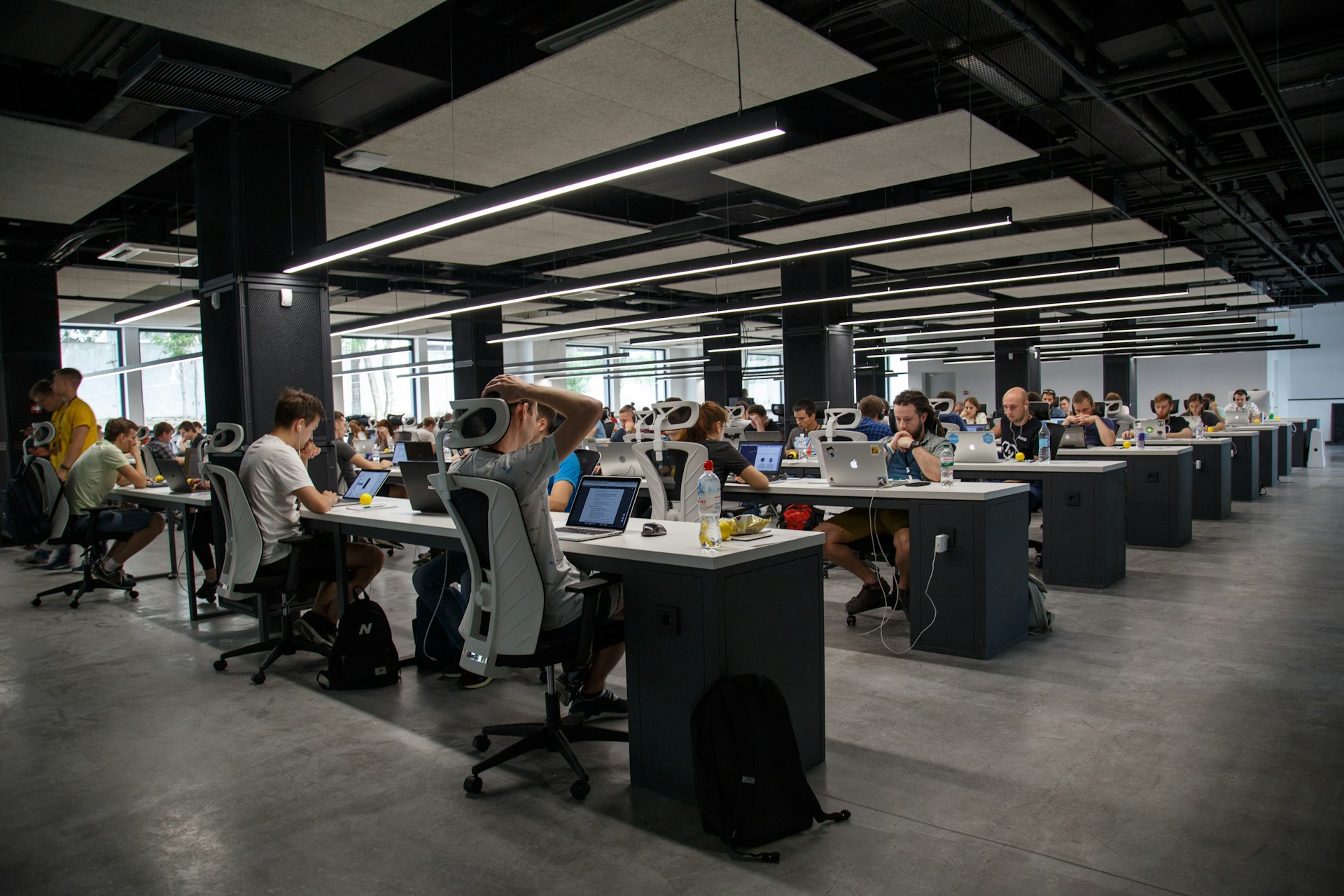 Engineering team in a late build session wiring document automation and listing generation pipelines